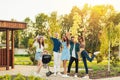 Group of young friends having barbecue party in nature, friends fry meat, chat and drink lemonade outdoors Royalty Free Stock Photo