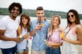 Group of friends having fun on the beach. Summer, fun, people, vacation concept. Royalty Free Stock Photo