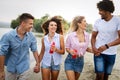 Group of friends having fun on the beach. Summer, fun, people, vacation concept. Royalty Free Stock Photo