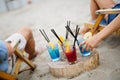 Group of young friends having fun at the beach on a sunny day. People vacation happiness concept. Royalty Free Stock Photo