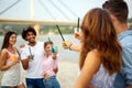 Group of young friends having fun at the beach on a sunny day. People vacation happiness concept. Royalty Free Stock Photo