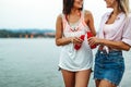 Group of young friends having fun at the beach on vacation party. People happiness concept Royalty Free Stock Photo