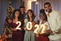 Friends holding numbers 2022 at New Years Eve party Royalty Free Stock Photo