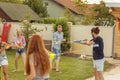 Friends playing with squirt guns Royalty Free Stock Photo