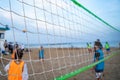 Group of young friends playing game volleyball on beach. Blurred background,. Royalty Free Stock Photo