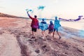 Young friends running with hand flare or fusee Royalty Free Stock Photo