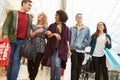 Group Of Young Friends Shopping In Mall Together Royalty Free Stock Photo