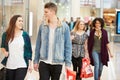 Group Of Young Friends Shopping In Mall Together Royalty Free Stock Photo