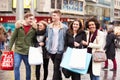 Group Of Young Friends Shopping Outdoors Together Royalty Free Stock Photo