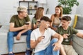Group of young friends smiling happy drinking red wine at home Royalty Free Stock Photo