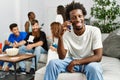 Group of young friends smiling happy sitting on the sofa Royalty Free Stock Photo