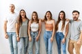 Group of young friends standing together over isolated background angry and mad screaming frustrated and furious, shouting with Royalty Free Stock Photo