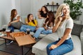 Group of young friends woman eating italian sitting on the sofa