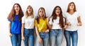 Group of young girl friends standing together over isolated background angry and mad screaming frustrated and furious, shouting Royalty Free Stock Photo