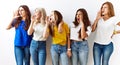 Group of young girl friends standing together over isolated background shouting and screaming loud to side with hand on mouth Royalty Free Stock Photo