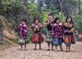 Group of young girls on farm road in mountains.