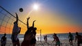 Group of young girls playing beach volleyball during sunset Royalty Free Stock Photo