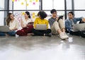 Group of young happy Asian creative business people or hipster student using electronic devices tablet and laptop connection Royalty Free Stock Photo