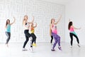 Group of young happy women wearing colorful sportswear dancing at dance class Royalty Free Stock Photo