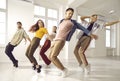 Group of young hip hop dancers rehearsing new choreography in their modern studio Royalty Free Stock Photo