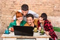Group of young hipster best friends with computer laptop Royalty Free Stock Photo