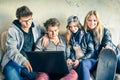 Group of young hipster best friends with computer Royalty Free Stock Photo