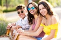 Group of young hipster friends talking in an urban area. Royalty Free Stock Photo