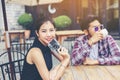 Group of young hipster sitting in a cafe,Young cheerful friends having fun while take time together, Holiday freedom enjoy