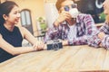 Group of young hipster sitting in a cafe,Young cheerful friends having fun while take time together, Holiday freedom enjoy