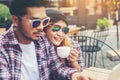 Group of young hipster sitting in a cafe,Young cheerful friends having fun while take time together, Holiday freedom enjoy