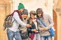 Group of young hipster tourist friend having fun with smartphone Royalty Free Stock Photo