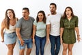 Group of young hispanic friends standing together over isolated background angry and mad screaming frustrated and furious, Royalty Free Stock Photo