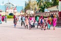 Group of young Indian people painted colored face walking in city street Celebrate Holi Party. Biggest hindu Festival of colors,