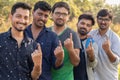 Group of Young Indian Voters showing fingers after casting there votes. Royalty Free Stock Photo