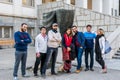 A group of young Iranian tourists standing statue of the Shah`s Legs in Sa`dabad palace Complex, built by the Qajar and Pahlavi