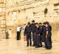 A group of young Israelis in police uniform are doing a picture in memory of the visit to the Wailing Wall