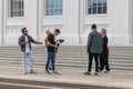 Group of young journalists during the filming of an interview