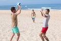 Group young joyful girls playing volleyball on beach Royalty Free Stock Photo