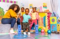 Early development games in kindergarten kids jump Royalty Free Stock Photo