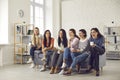 Group of young laughing positive women watching movie together