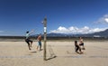 Group of Young Men Playing Volleyball on Vancouver Kits Beach