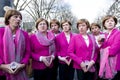 Group of young men posing as Angela Merkel on street carnival in Dusseldorf