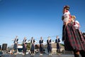 group of young men and women dancing a Serbian kolo in Pecicni, serbia