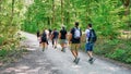 Group of young men and women hiking in the Moselle River Valley near Burg Eltz Castle in Germany