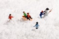 Group of young miniature children playing in snow Royalty Free Stock Photo