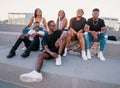 Group of young modern african black friends happily sitting together Royalty Free Stock Photo