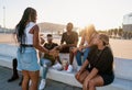 Group of young modern african black friends happily sitting together Royalty Free Stock Photo