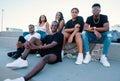 Group of young modern african black friends happily sitting together Royalty Free Stock Photo