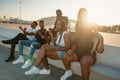 Group of young modern african black friends happily sitting together Royalty Free Stock Photo