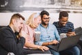 A group of friends using laptop and laughing Royalty Free Stock Photo